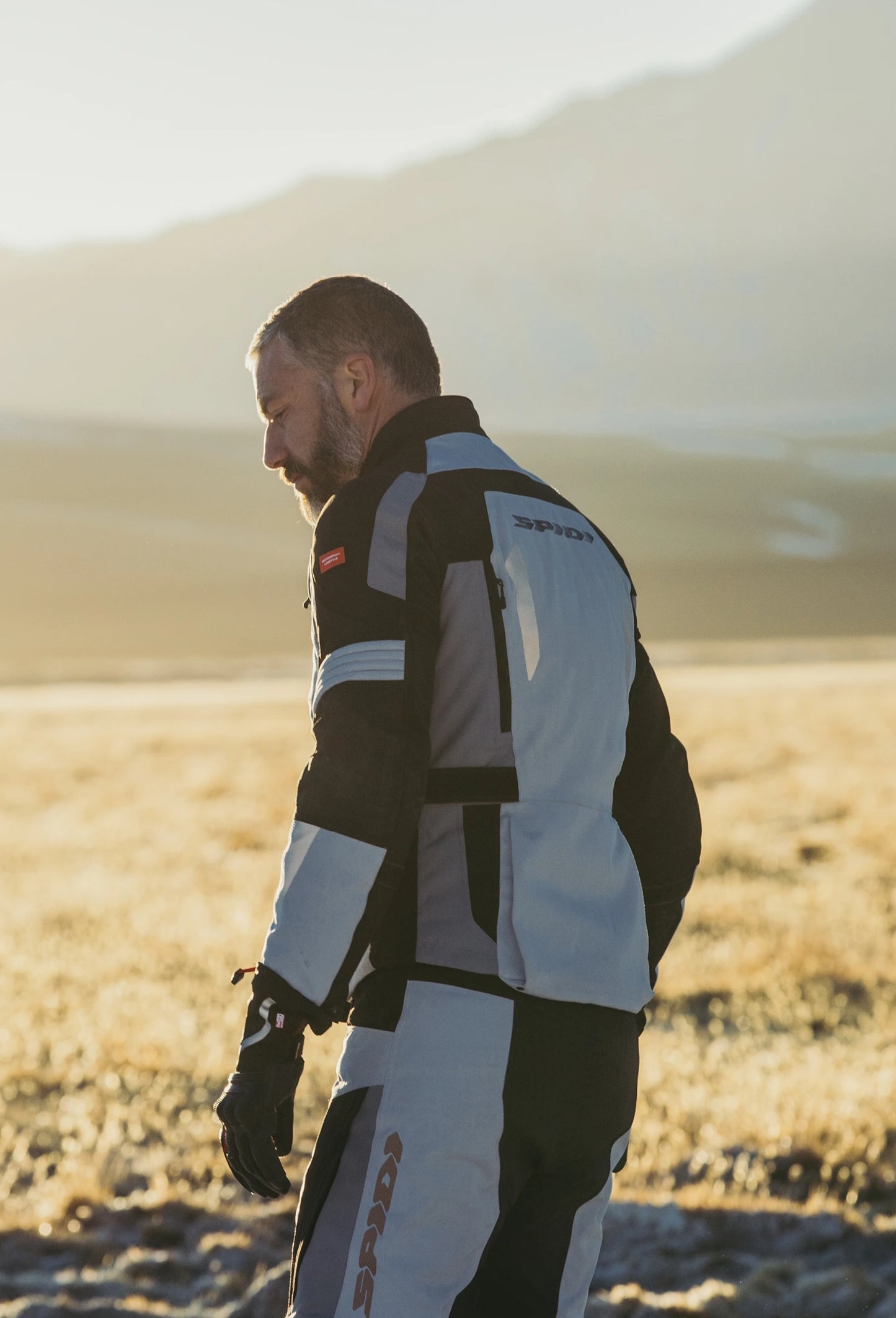 Spidi Alpentrophy H2Out Black Grey Winter Jacket for motorcycle enthusiasts features a waterproof, breathable H2Out membrane, CE certified protection, removable thermal liner, and customizable fit with reflectors for enhanced